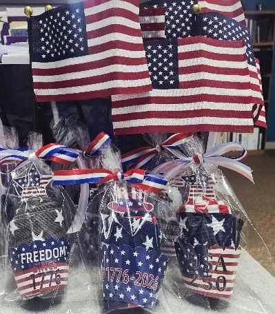 Patriotic gift packages with American flags prepared for veteran hospice pinning ceremonies